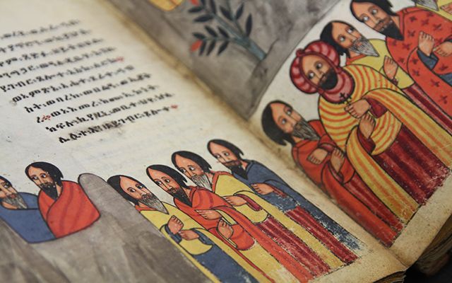 Group of men wearing colourful robes from an Ethiopic manuscript