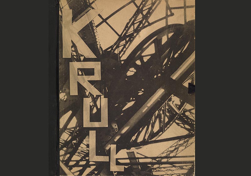 A bold front cover with a beige and grey graphic print and the word 'KRULL'