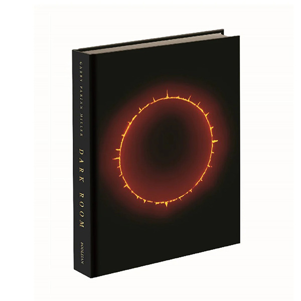 A 3D view of the front cover of 'Dark Room', a bright spiked orange-red circle on a black background