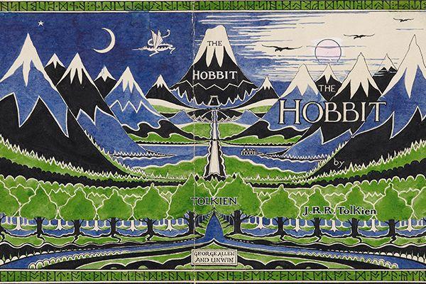 An illustration of mountains and trees in green and yellow with the word "Hobbit"