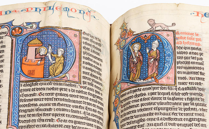 A spread of an illuminated manuscript showing a decorated letter 'P' and 'M'