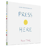 Photograph of a book cover: the words "Press" and "Here" are written in blue with a large yellow dot in between them