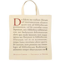 A cream tote bag with the text of an oath written on the outside