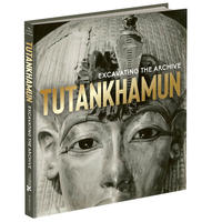 Book cover: A black and white photograph of the Tutankhamun mummy mask with the title of the exhibition catalogue written on top of it